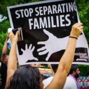 Woman Holding Stop Separating Families Sign